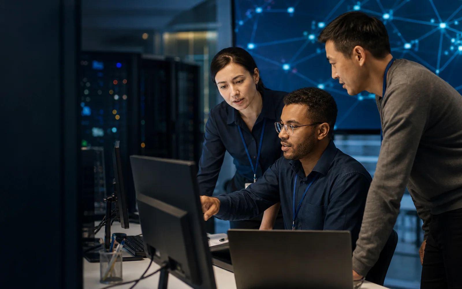 Telecommunications professionals collaborating in a network operations environment